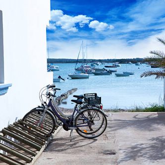 Estany des Peix in formentera with bicycles parking lot and white Mediterranean houses